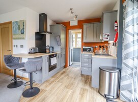 Fridge, electric kettle, toaster, cookware/dishes/utensils