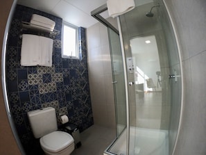 Shower, rainfall showerhead, hair dryer, towels