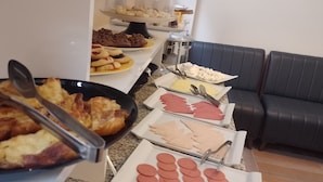 A buffet with various food items including pastries, cookies, and sliced meats. - BALPETEK HOTEL (Istanbul)
