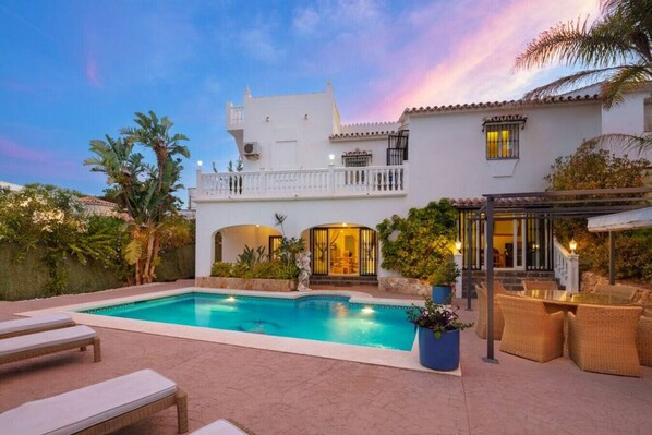 A heated pool, pool loungers
