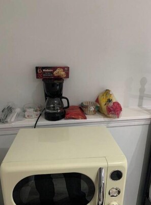 Enjoy a convenient kitchenette with a microwave oven, coffee maker, and ample storage for your essentials.