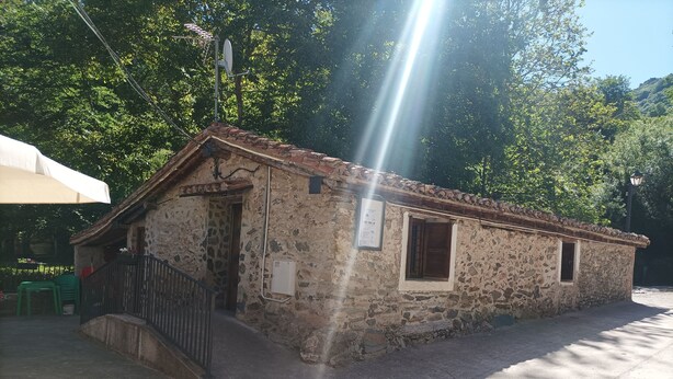 A rustic stone building with a tiled roof, a small window, and a door. - The Corner of Azarrulla (Azarrulla)