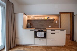 Fridge, oven, coffee/tea maker, cookware/dishes/utensils