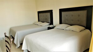 Family Quadruple Room | Down comforters, blackout drapes, soundproofing, free WiFi - Hotel Insurgentes (Tepic)