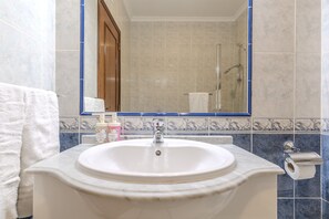 Bathtub, hair dryer, soap, shampoo