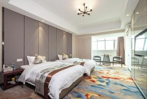 A hotel room with two beds, a large window, a glass partition, and a modern chandelier. - Jingdian Hotel (Nan'an)