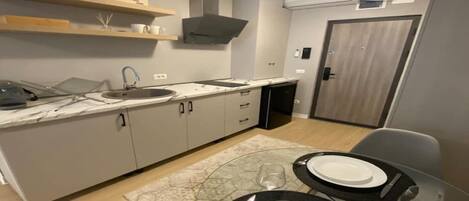 Microwave, stovetop, coffee/tea maker, cookware/dishes/utensils