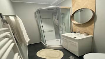 Shower, towels, soap, toilet paper