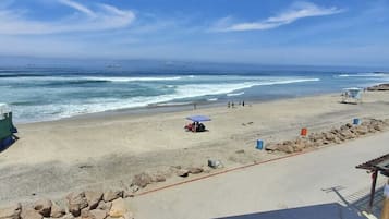 On the beach, sun-loungers, beach towels