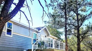 A two-story house with a front deck and a staircase leading to the entrance. - Zion Fence Line - Walk to Trailhead  - Secluded (Orderville)