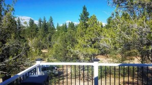 A deck with a railing overlooking a forested area. - Zion Fence Line - Walk to Trailhead  - Secluded (Orderville)