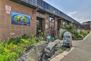 A theater with a brick facade, a large outdoor advertisement, and a sidewalk with a signboard. - Idyllic Dtwn Anchorage Condo w/ Fireplace! (Anchorage)