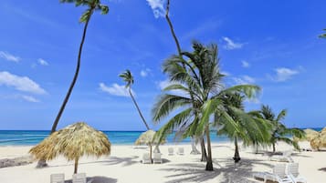 On the beach, sun loungers, beach towels