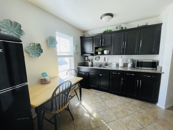 Fridge, microwave, stovetop, coffee/tea maker