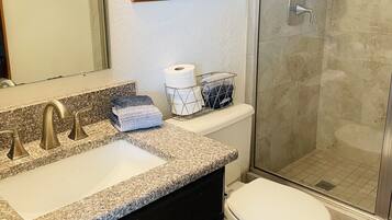 Shower, hair dryer, towels, soap