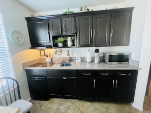 Fridge, microwave, stovetop, coffee/tea maker