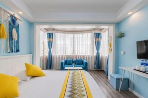 A hotel room with a bed, a sofa, a TV, and a window with curtains. - Awuka Guesthouse (Hangzhou)