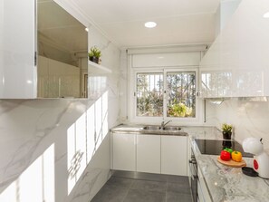 Microwave, toaster, high chair, dining tables