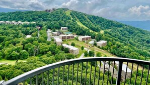 A residential area with multiple buildings surrounded by lush greenery and hills. - 2017 Top Floor Condo Of SugarTop Resort w/ Pool, Hot Tub, Breathtaking Views (Sugar Mountain)