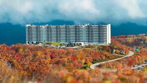 A multi-story hotel with a modern design, situated on a hillside with autumn foliage. - 2017 Top Floor Condo Of SugarTop Resort w/ Pool, Hot Tub, Breathtaking Views (Sugar Mountain)