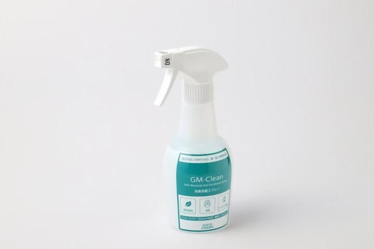 A bottle of GM Clean spray with a white pump nozzle.