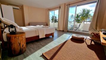 Suite Premium, tina, vista al mar | Insonorización y ropa de cama