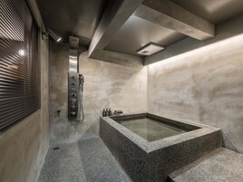 Traditional House | Bathroom | Combined shower/tub, deep soaking tub, rainfall showerhead, hair dryer