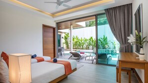 A hotel room with a bed, bedside lamp, and a view of a pool and outdoor seating area. - Trendy 4BR Villa Kari in KA Villas Rawai (Rawai)