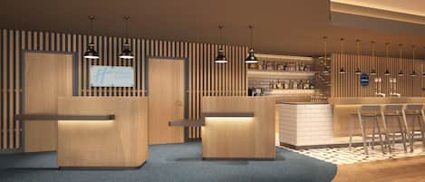 A modern bar area with wooden accents, bar stools, and a minibar.