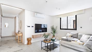 Apartment, 2 Bedrooms | Living area | 65-inch LCD TV with digital channels, TV