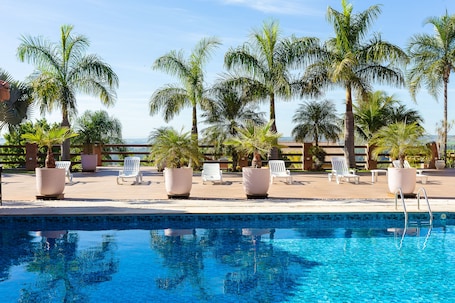 Outdoor pool, open 9:00 AM to 6:00 PM, pool umbrellas, pool loungers