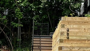 A wooden staircase with a metal railing leading up to a door. - Modern, Chic Adult ONLY Retreat On Hill w/Sunset Views Steps from Downtown  (Saugatuck)