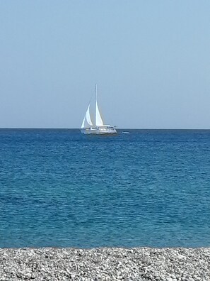 On the beach, sun loungers, beach towels