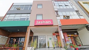 A multi-story building with a prominent 'Jashan' sign on the facade. - Itsy Hotels Jashan (Mohali)