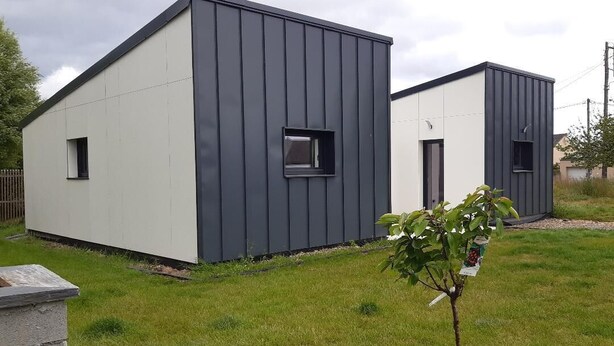 Two modern, single-story buildings with a minimalist design, featuring large windows and a flat roof. - New single-storey house 800 metres from the sea and footpaths (Pleubian)