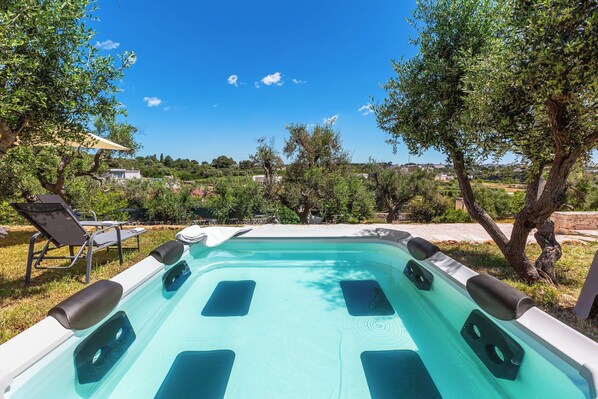 A swimming pool with a view of the surrounding landscape.