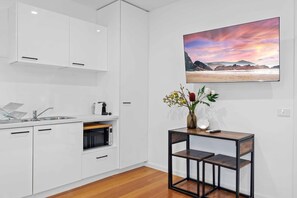 Fridge, microwave, stovetop, coffee/tea maker