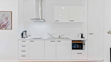 Fridge, microwave, stovetop, coffee/tea maker