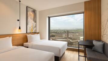 Deluxe Room, 2 Single Beds, Garden View | Minibar, in-room safe, desk, laptop workspace