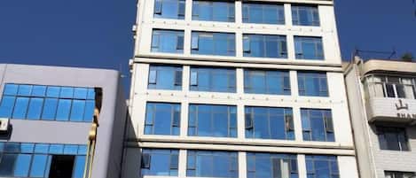 A multi-story building with a clear sky.