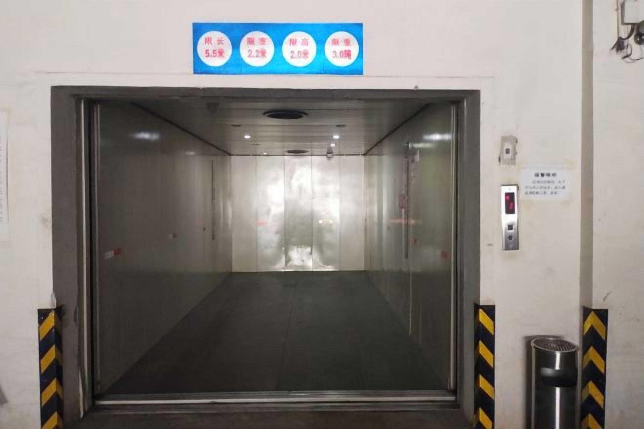 An elevator with a control panel and a sign indicating floor levels.
