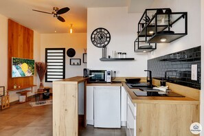 Fridge, microwave, stovetop, coffee/tea maker