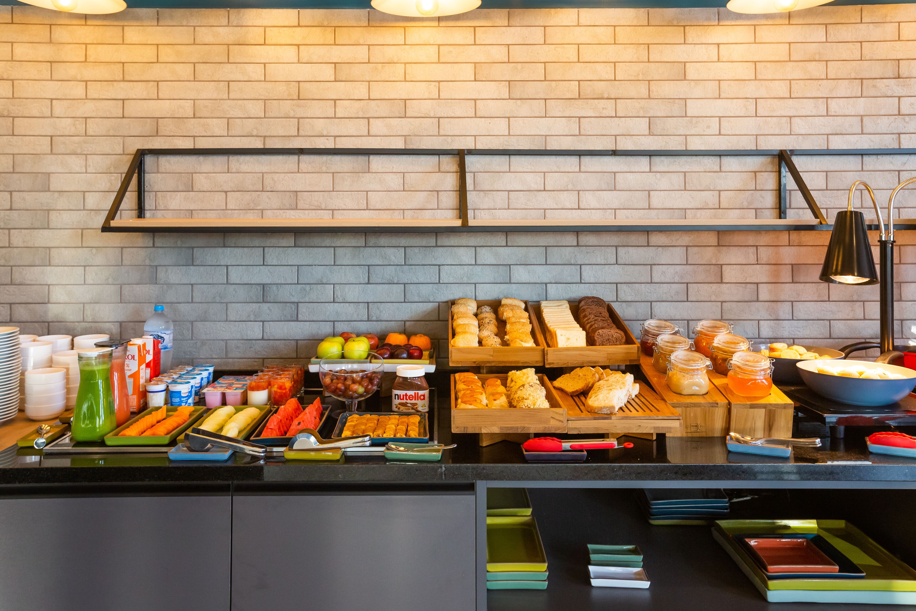A buffet area with various food items and beverages.