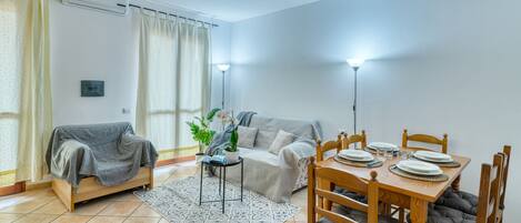 Basic Apartment | Living area | 49-inch flat-screen TV with cable channels, TV
