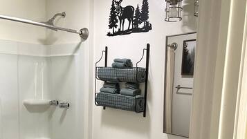 Combined shower/tub, hair dryer, towels, soap