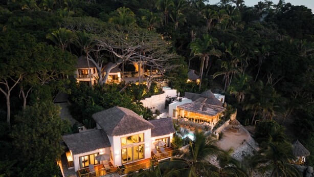 A resort with multiple buildings, a pool, and lush tropical vegetation. - La Joya Sayulita (Sayulita)