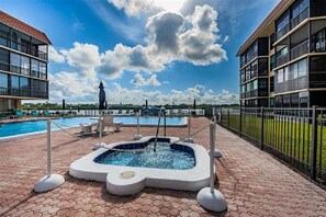 Outdoor pool, a heated pool - Water front 2b, 2ba condo with white-sand beach across the street (Indian Shores)