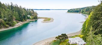 Waterfront retreat with private beach, cookhouse, hot tub, EV charger, & firepit