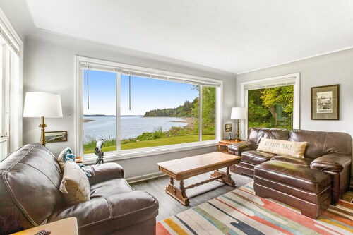 Waterfront retreat with private beach, cookhouse, hot tub, EV charger, & firepit