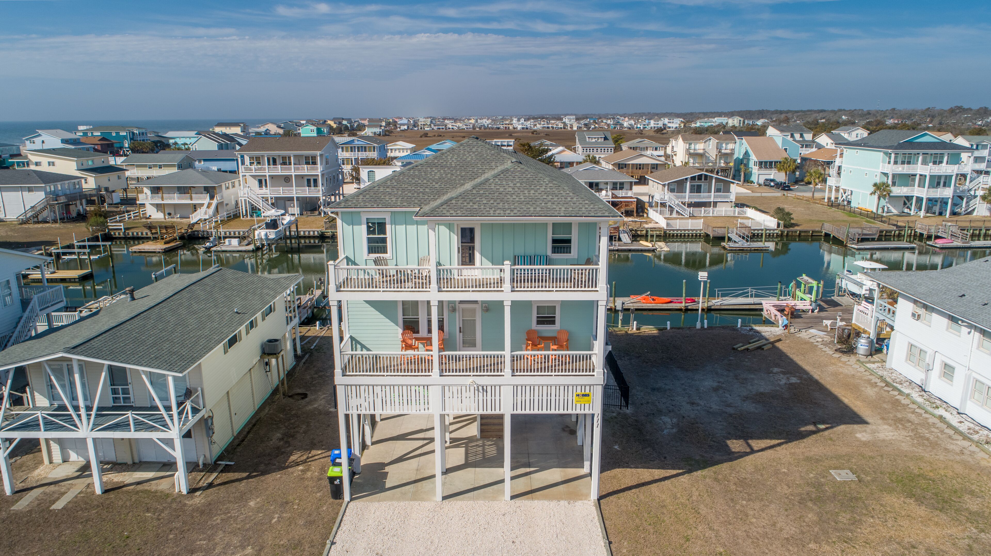 Hobbs Realty - This charming 4 bedroom canal home "Hook, Wine, and Sinker" has it all!
